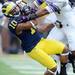 Michigan wide receiver Jeremy Gallon comes down with a big catch over Northwestern safer Ibraheim Campbell during the third quarter at Michigan Stadium on Saturday. Melanie Maxwell I AnnArbor.com